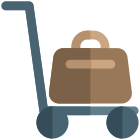 Suitcases carried by trolley service in the hotel icon