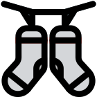 Drying the socks on a string with the help of clips icon